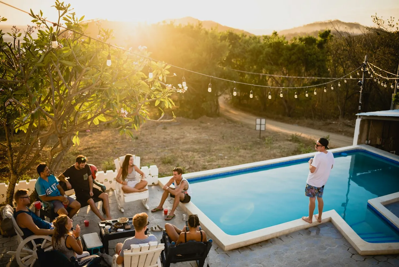 People relaxing at a pool party